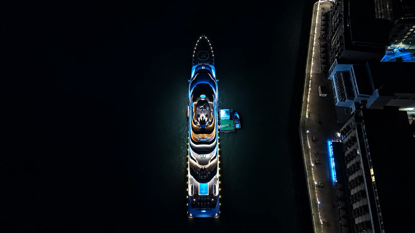 Night-time aerial of a yacht